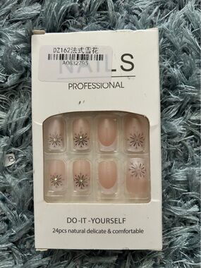 Professional Press-On Nails - Nude Floral Design with Crystal accents.